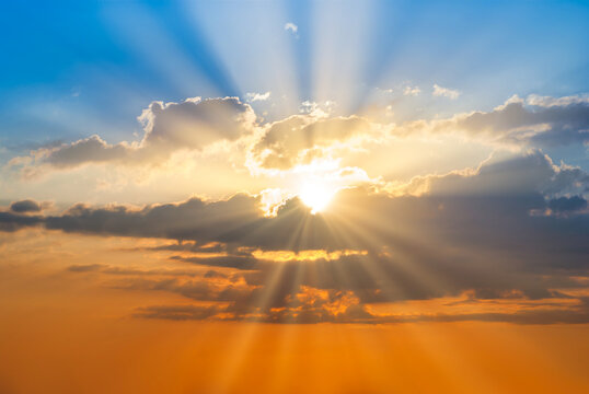 Sunset sky clouds with sun rays. Sunset sky landscape for background - Powered by Adobe
