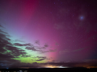 Northern lights in Saxony, Germany on the 11. October 2024. Beautiful colors ranging from green to magenta and red in the night sky. Light rays of the aurora borealis are visible in Europe.