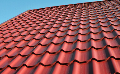 The roof of the house is covered with metal tiles