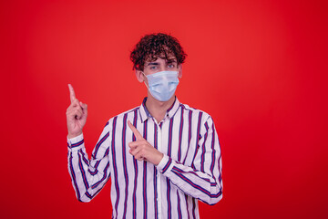 Fototapeta premium Young attractive guy and cold. Red background.