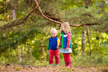 Kids hiking in autumn park