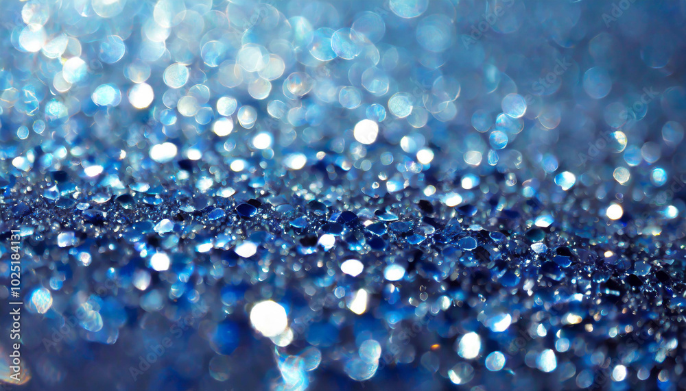 Poster blue droplets scatter across a shimmering surface, capturing light in an abstract display of reflect