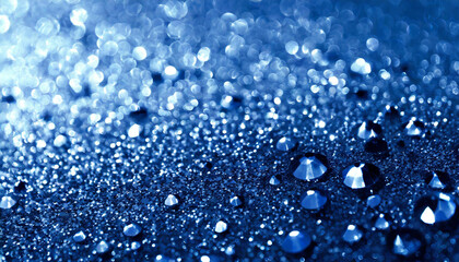 Glittering water droplets on a blue surface, creating a stunning visual effect during early morning light