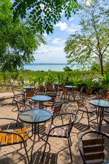 table and chairs in the nature with a beautiful Lake Balaton view in Folly arboretum