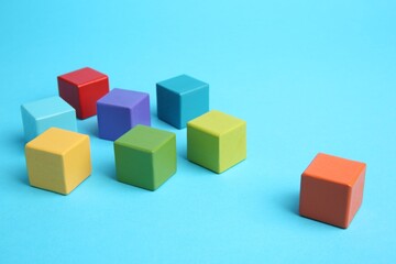 Obraz premium Many colorful cubes on light blue background