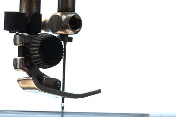 Sewing machine on white background, macro view. Space for text