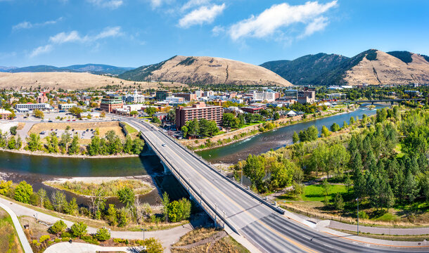 Aerial panorama of Missoula, Montana, above Beartracks Bridge. Missoula is a city in and the county seat of Missoula County, Montana. It is located along the Clark Fork River.