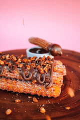 Churros caseiro com açúcar e chocolate, churros gourmet
