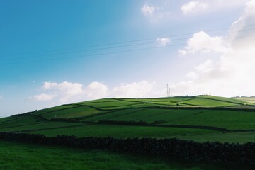 Lush Green Hills of Terceira Island Under a Bright Sky