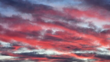 Pink sunset in the sea and mountains, beautiful clouds color