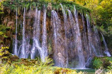 Waterfall in the Plitvice Lakes in Croatia. The waterfalls in forest. Summer view of beautiful...
