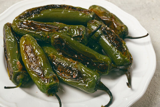 fried padron pepper, in a frying pan, with olive oil, and sea salt, homemade, no people.