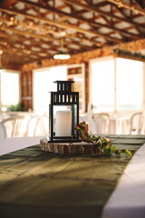 A candle centerpiece at a wedding reception.