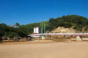 Pobeña cable-stayed bridge over the Barbadún river and the beach