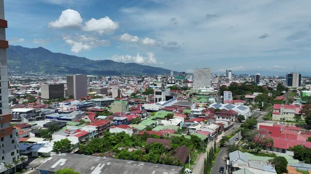 San Jose, Costa Rica day drone video. Aerial footage of the Costa Rican capital city near Barrio Escalante looking towards downtown.