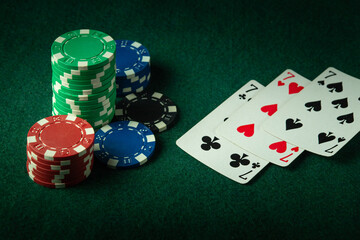 A successful combination of playing cards from three of a kind or set on a table in a poker club. A big win depends on luck and fortune