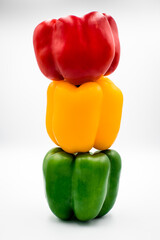 Colorful red, yellow, green peppers.
