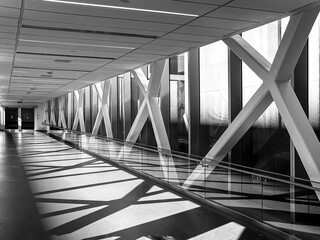 A pedestrian bridge with sunlight and shadows 