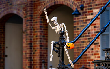 Halloween skeleton decorations. Halloween skeleton for decorated house. Scary skeleton Decorated at front yard of a American home. Trick or treat. Halloween skeleton background.