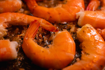 fried red shrimp in a pan, cooking fish dishes, fish food, selective focus, background