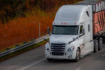 Heavy truck on a Canadian highway in the fall in Quebec