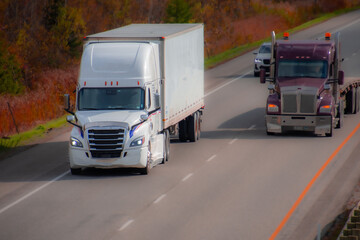 Fototapeta premium Heavy truck on a Canadian highway in the fall in Quebec