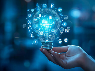 A hand holds a glowing lightbulb with digital icons floating around it
