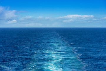 Ocean view from the stern of a cruise ship with the ship’s wake