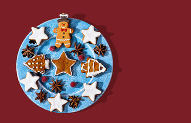 christmas cookies on a plate on red background