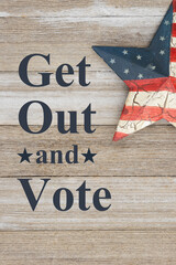 Get out and vote message with retro USA red, white and blue star on wood