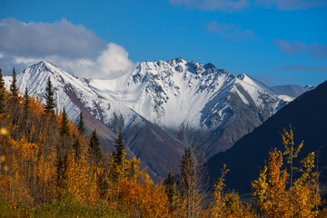 Snow covered mountains along Glen highway in Alaska during autumn time.