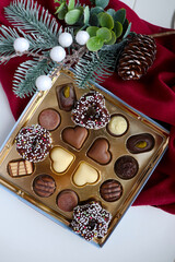 fir branches, gift box and chocolates