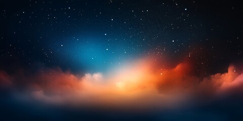 A night sky with stars and clouds, the sky is a mix of blue and orange.