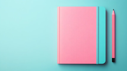 A vibrant pink notebook and a matching pencil on a turquoise background, perfect for creative writing and planning.
