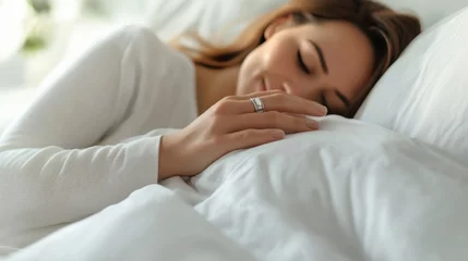 Canvas schilderij Nagelstudio Woman sleeping peacefully on a white pillow with her hand visible, showcasing a silver ring, in a cozy indoor setting during the day  © Luiri Art