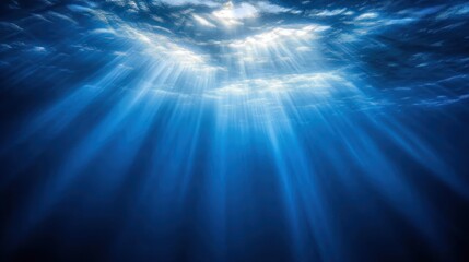 Underwater scene with sunbeams shining through the water.