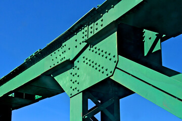 Truss Bridge Abstract. Rivets are distributed using the “Chain Riveting” technique to...