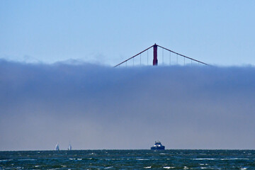 Escort Tug leaving bay and meeting incoming ship to help navigate through fog bank and San Francisco Bay