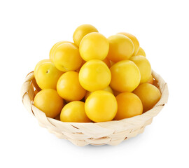 Fresh ripe yellow plums in wicker basket isolated on white