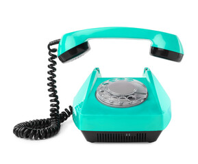 Old turquoise color telephone with rotary dial isolated on white