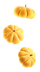 Pumpkin shaped buns in air on white background