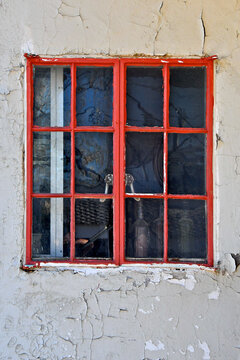 Old crank windows with &ldquo;Muntins&rdquo; thin strips of wood or metal used to hold panes of glass within a window,  Goldfield, Nevada 