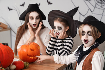 Happy family celebrating Halloween at home