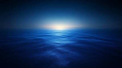 Obraz premium Calm blue ocean water with a bright light in the distance, creating a peaceful and serene scene.