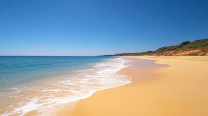 Obraz premium A beautiful, serene beach with clear blue water, white sand, and a bright blue sky.