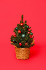 Small Christmas tree on red background