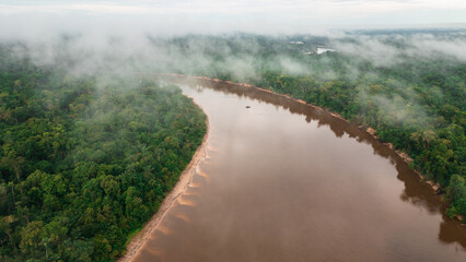 NANAY RIVER IN THE PERUVIAN JUNGLE, A LARGE AND COLORFUL BLACK WATER RIVER IN THE DEPTHS OF THE...