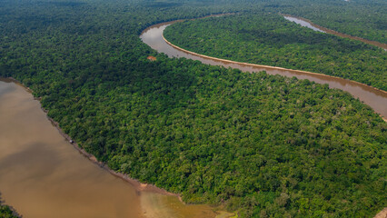 NANAY RIVER IN THE PERUVIAN JUNGLE, A LARGE AND COLORFUL BLACK WATER RIVER IN THE DEPTHS OF THE JUNGLE, A RIVER SURROUNDED BY TREES
