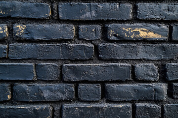Naklejka premium Texture of black painted brick wall creating a bold and industrial background 