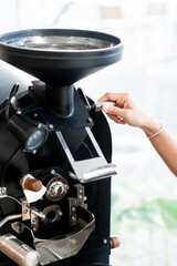 Hand Adjusting a Modern Coffee Grinder
